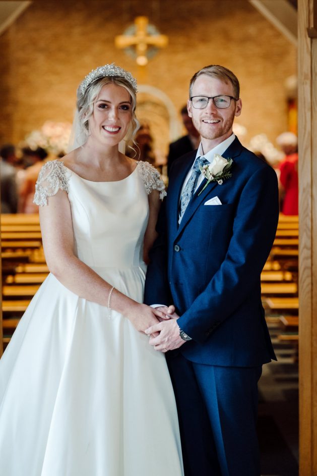 Bride & Groom in Church Doorway on their wedding day