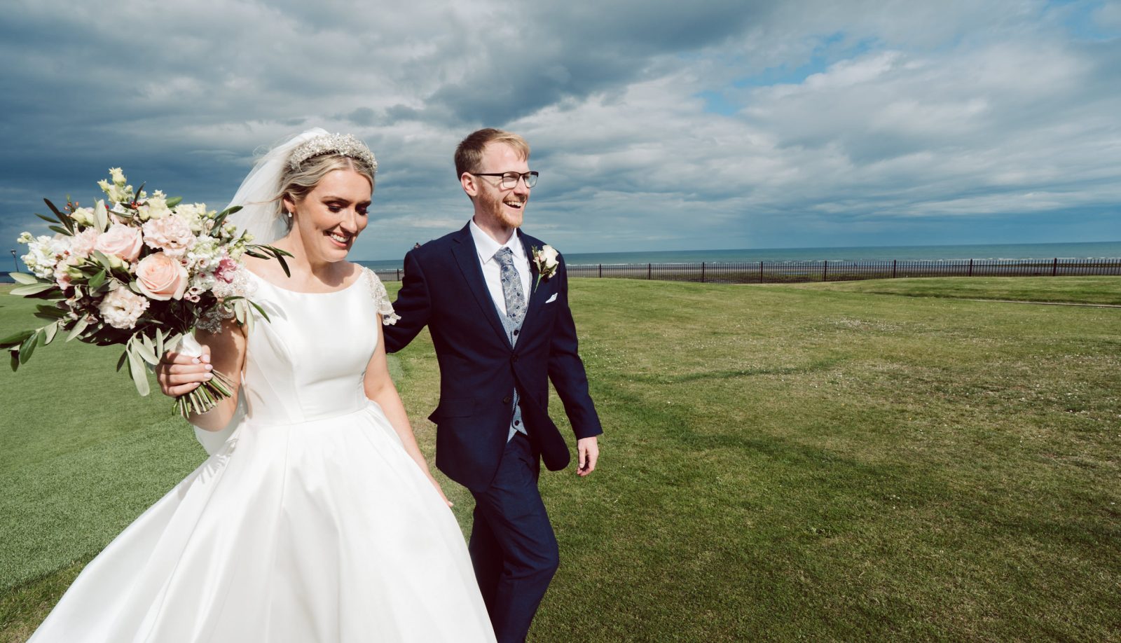 Bride & Groom pictured walking at Slieve Donard Hotel in Newcastle County Down