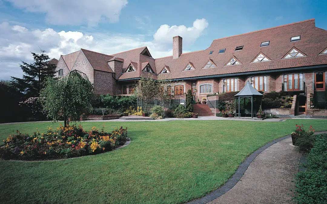 Modern wedding venue at Rabbit Hotel & Retreat in Templepatrick, featuring landscaped gardens, elegant architecture, and a serene outdoor setting ideal for photography.